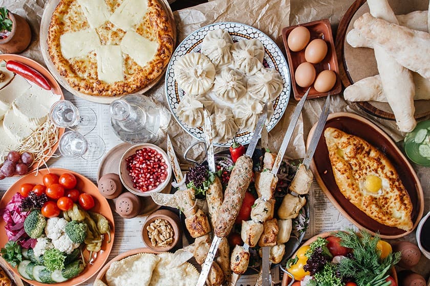 Georgian supra table with wine and food